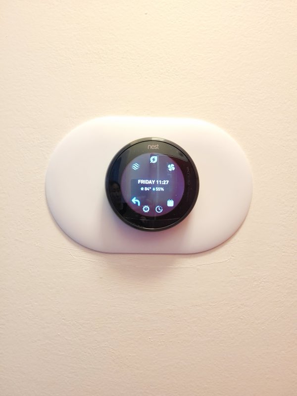 Smart thermostat installed on a wall by AirTech